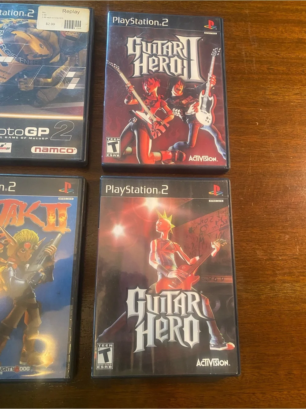 6 PS2 Jak II, Guitar Hero I & II, Splinter Cell, MotoGP 2, X Games Skateboarding